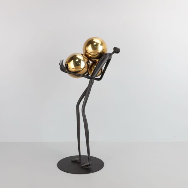 FIGURE HOLDING BALLS DECOR