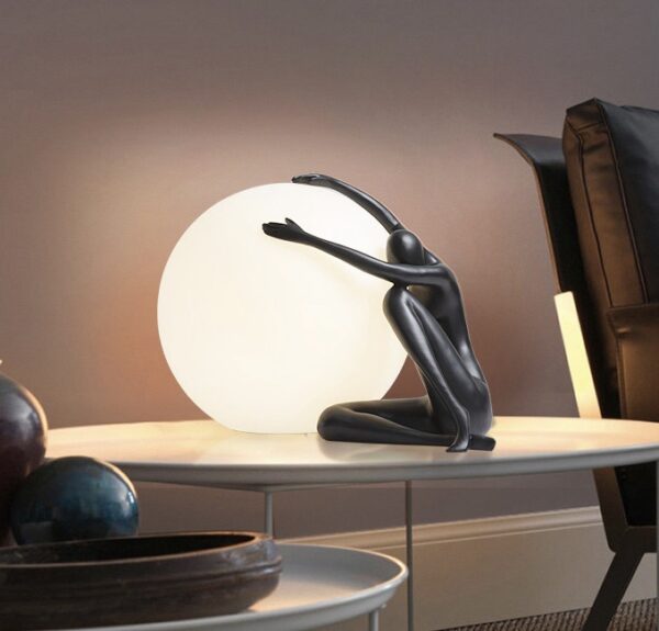 MAN HOLDING LIGHT BALL DECOR